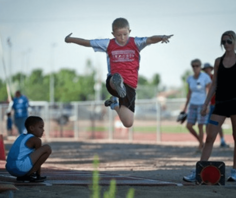 2010 boy during meet doing long jump