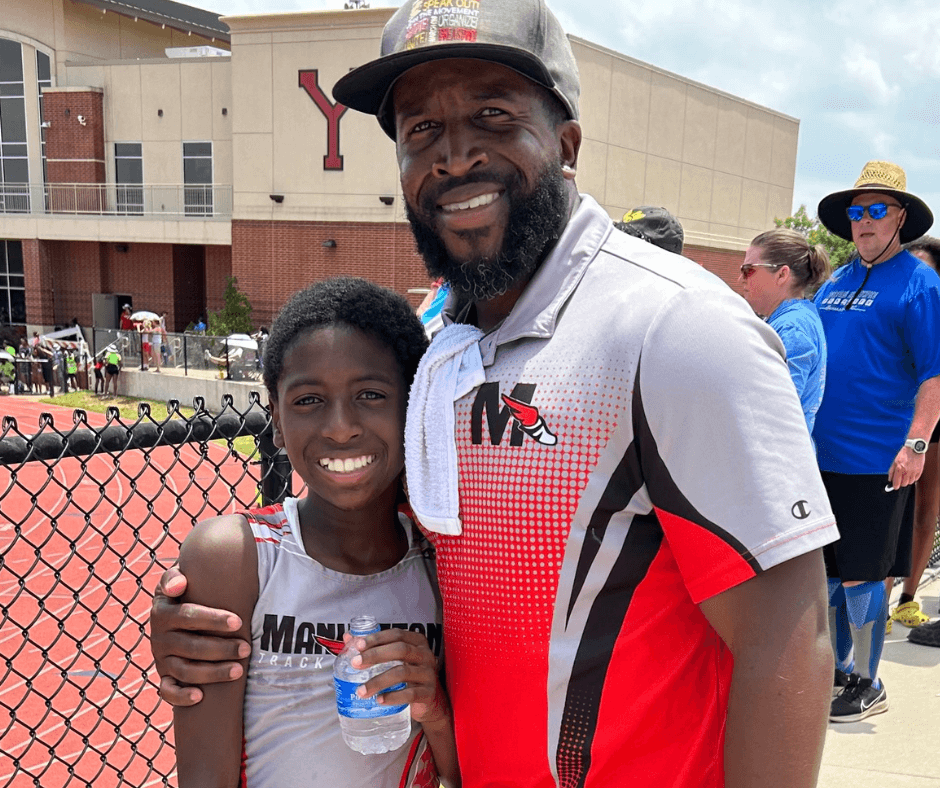 coach and runner smiling